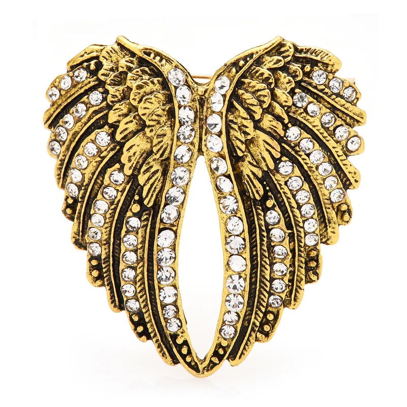 Broche ailes emplumées ornées de bijoux