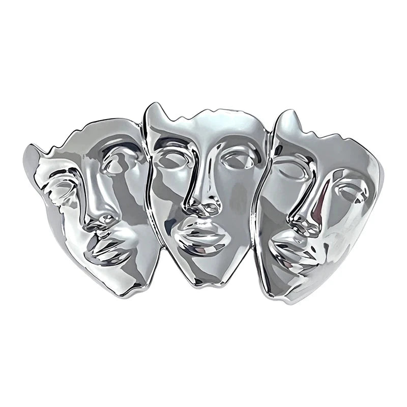Sculptural Trio of Faces Brooch original white background product photo
