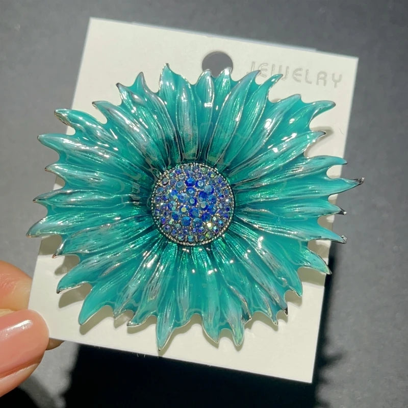 Broche tournesol en émail avec centre orné de joyaux