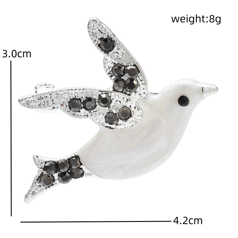 Broche à motifs botaniques et animaliers en émail