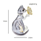 Cat Holding Jeweled Butterfly Brooch