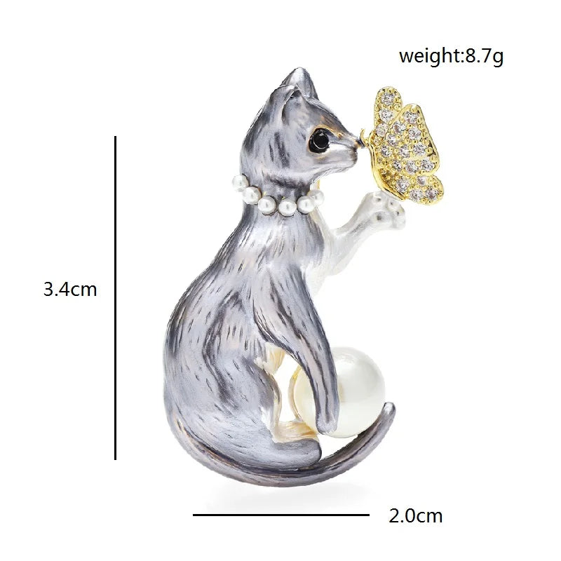 Cat Holding Jeweled Butterfly Brooch