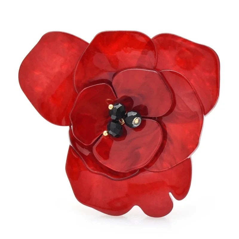 Broche fleur en acrylique superposé avec centre en perle noire