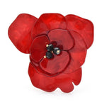 Broche fleur en acrylique superposé avec centre en perle noire