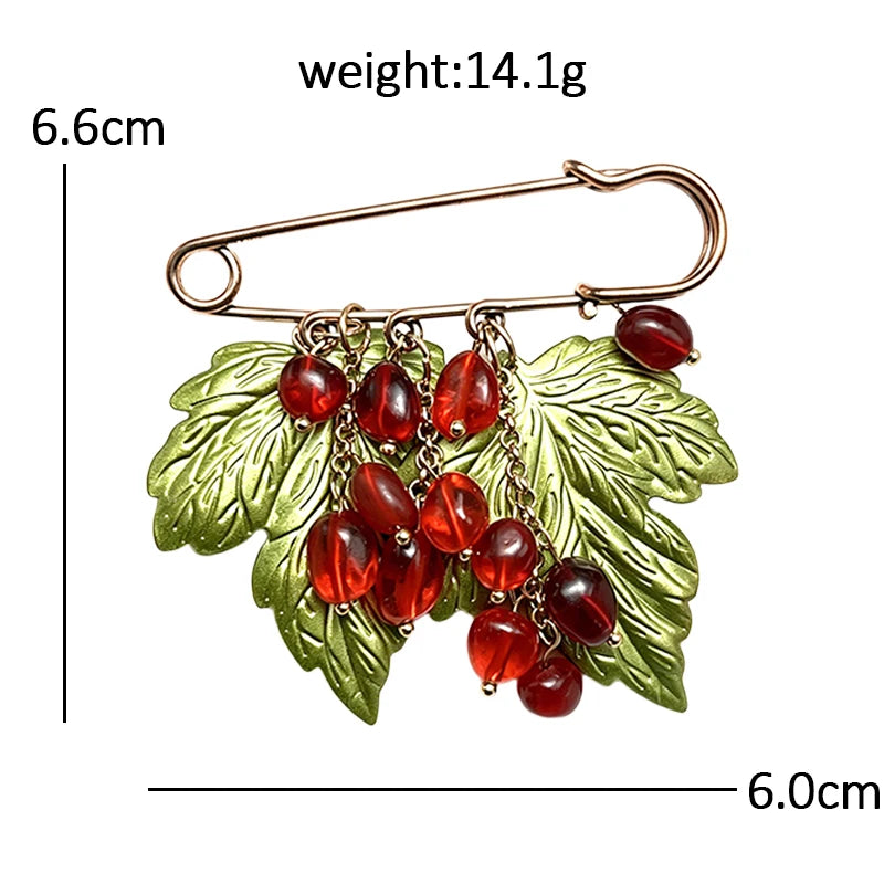 Broche grappe de baies et feuille