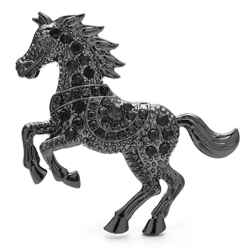 Broche cheval au galop ornée de bijoux