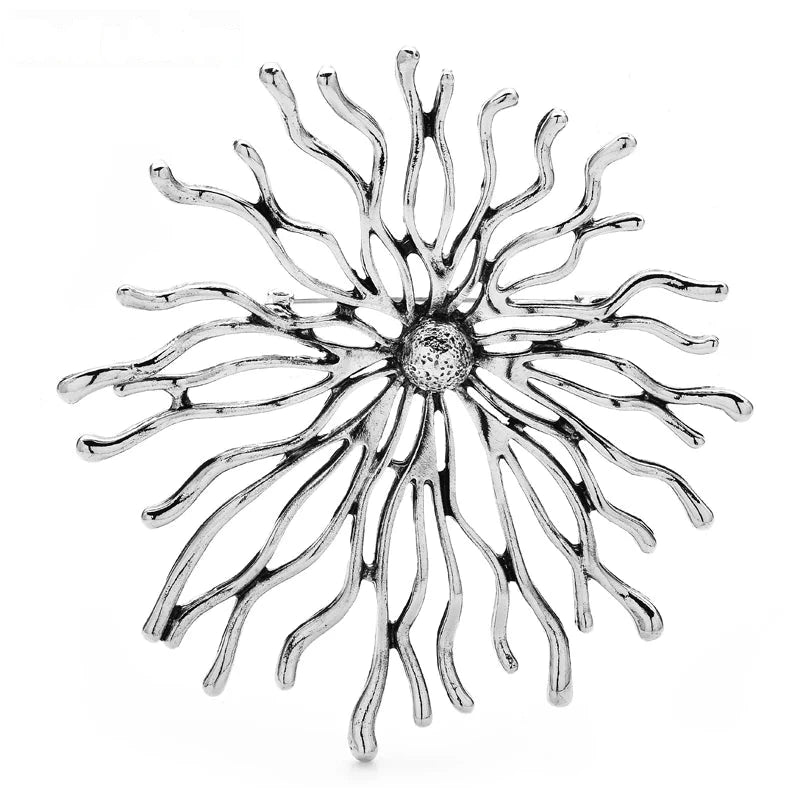 Sculptural Sunburst with Rhinestone Center Brooch — Silver