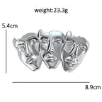 Sculptural Trio of Faces Brooch