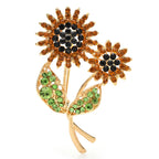 Broche double tournesol ornée de bijoux