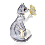 Cat Holding Jeweled Butterfly Brooch