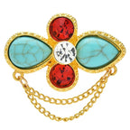 Faceted Floral Cross with Draped Chains Brooch — Blue