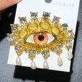 Jeweled Eye with Pearl-Look Drops Brooch