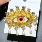 Jeweled Eye with Pearl-Look Drops Brooch