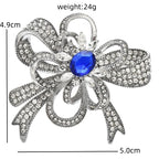 Rhinestone Flower Bow with Blue Center Brooch — dimensions