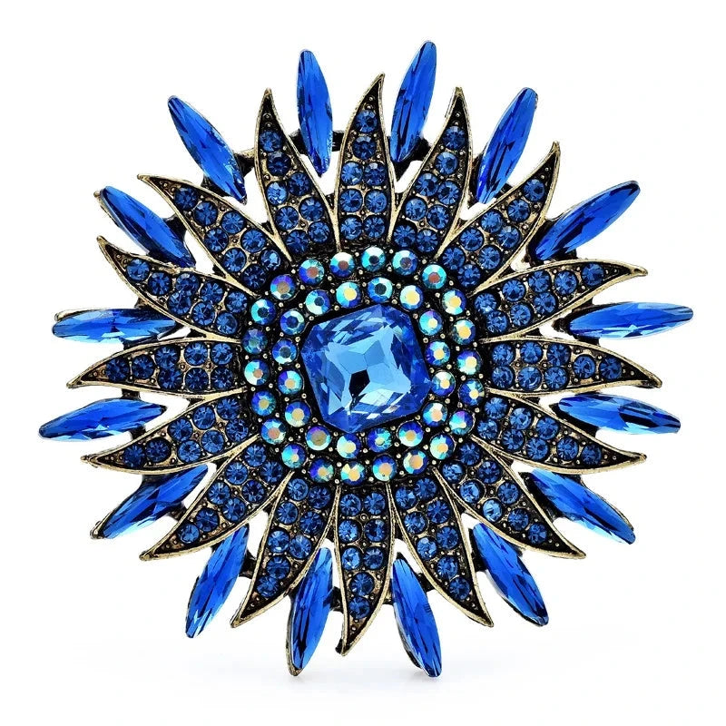 Radiant Rhinestone Sunburst Brooch — Blue