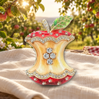 Apple Core Rhinestone Brooch styled in a thematic scene
