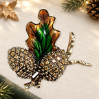 Autumn Pinecone and Leaf Brooch on an ivory themed backdrop