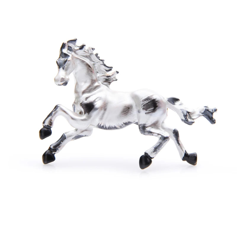 Broche cheval au galop en émail noir et blanc