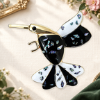 Black and White Mosaic Hummingbird Brooch on an ivory themed backdrop