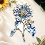 Blue and White Sunflower with Bee Brooch on a complementary display background
