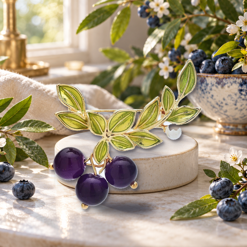 Blueberry Trio on a Leafy Branch Brooch styled in a thematic scene