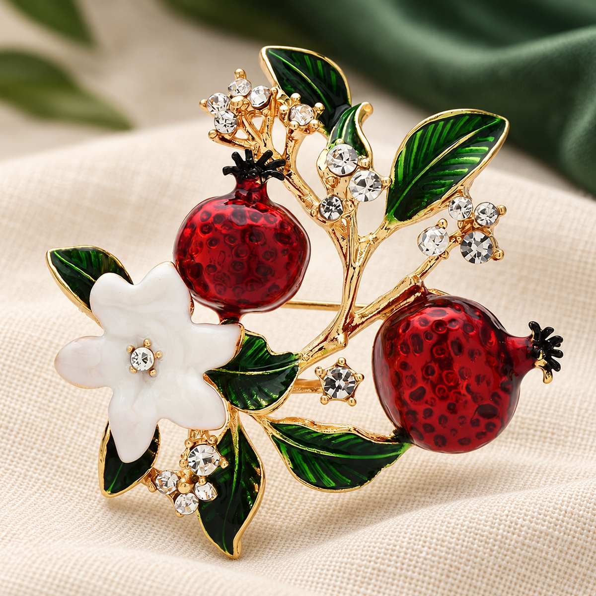 Enamel Pomegranate Branch with Flowers Brooch — styled background