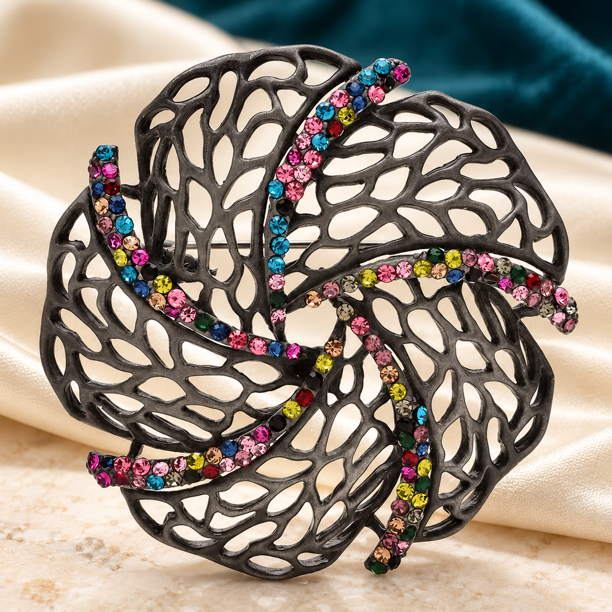 Openwork Leaf Swirl with Rhinestones Brooch — styled background