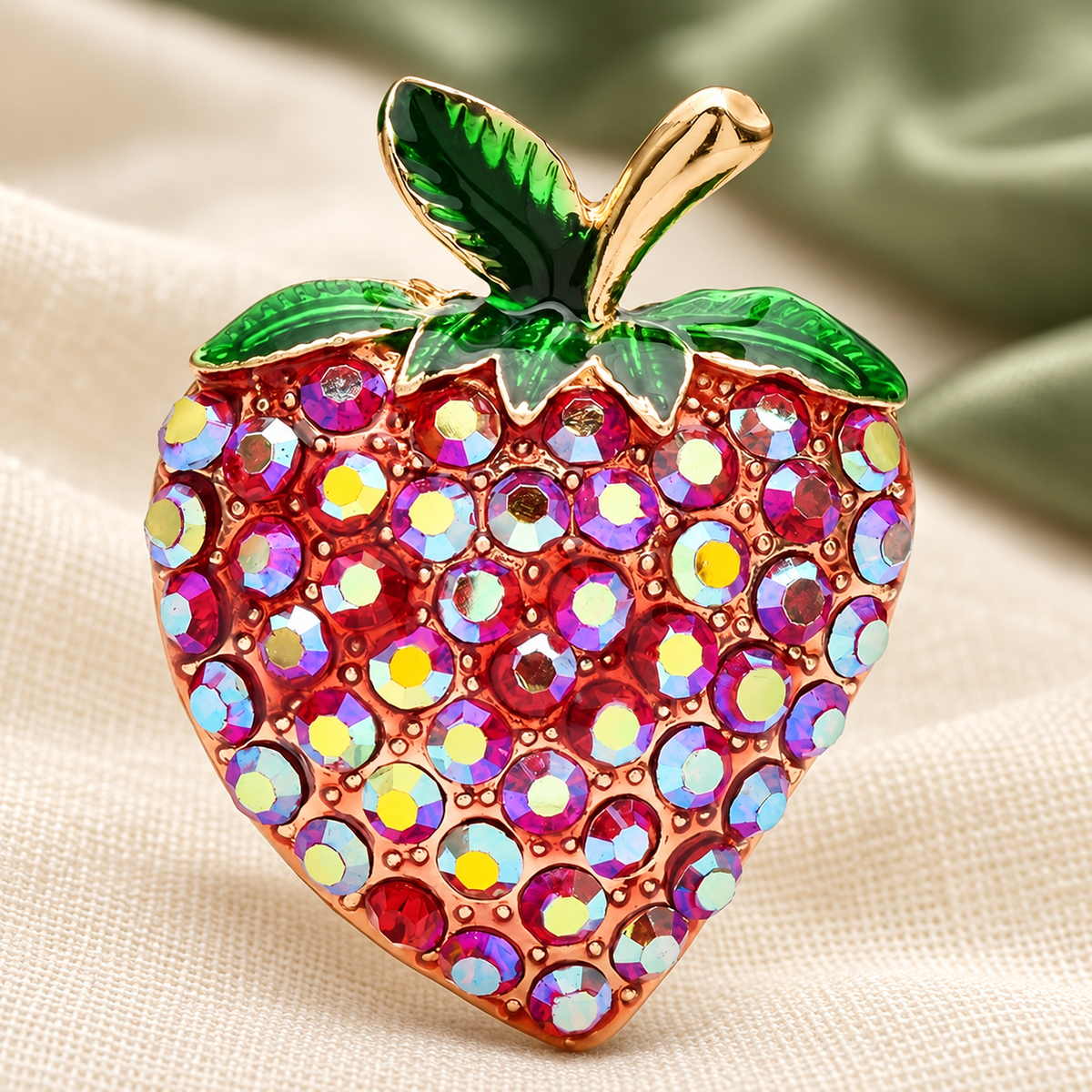 Iridescent Rhinestone Strawberry Brooch — styled background