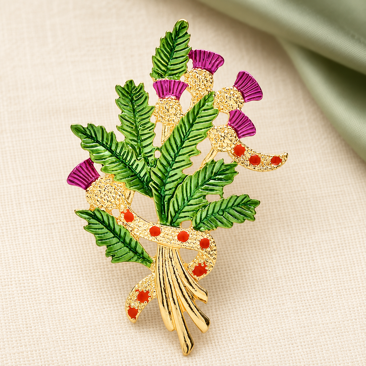 Enamel Thistle Bouquet with Ribbon Bow Brooch — styled background