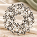 Rhinestone Flower Wreath with Pearl-Look Beads Brooch — styled background
