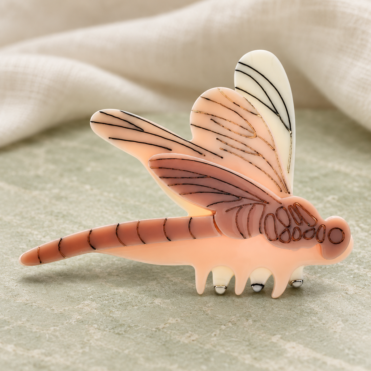 Layered Acrylic Dragonfly Brooch — styled background