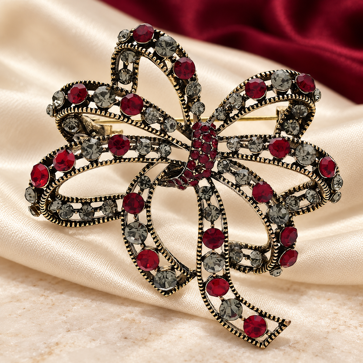 Vintage-Style Looping Rhinestone Bow Brooch — styled background