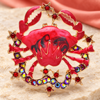 Red Enamel Crab with Jeweled Star Border Brooch — styled background