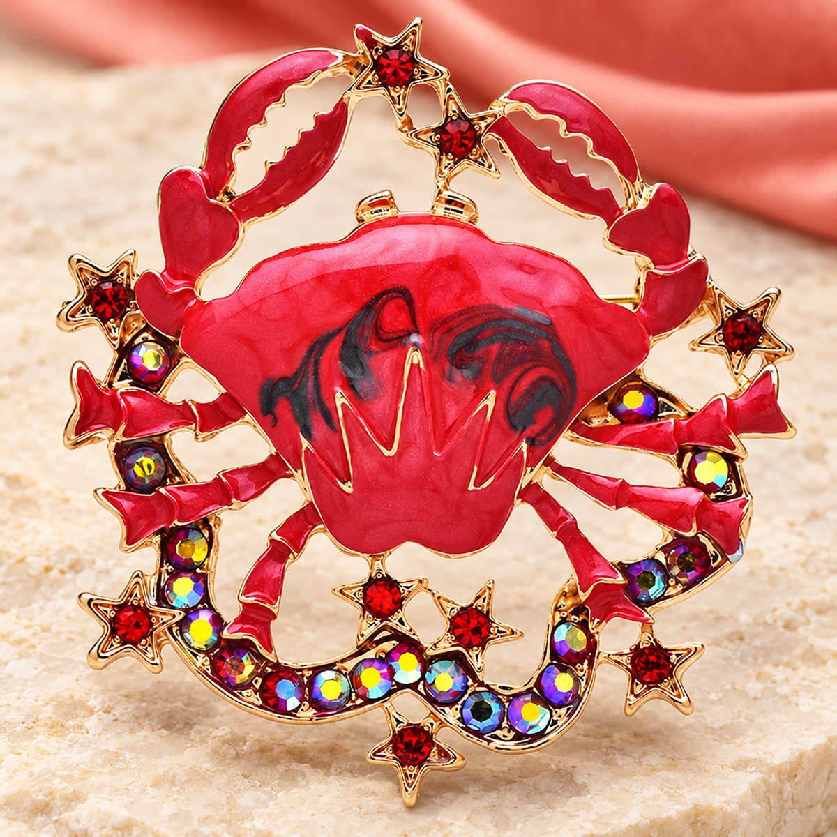 Red Enamel Crab with Jeweled Star Border Brooch — styled background