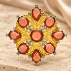 Amber-Tone Faceted Floral Medallion Brooch — styled background