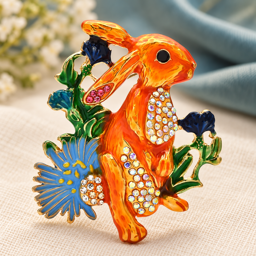 Orange Enamel Rabbit with Flowers Brooch — styled background