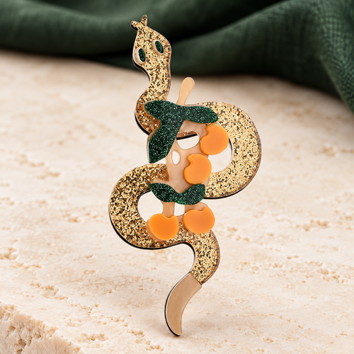 Acrylic Coiled Snake with Scarf Brooch — styled background
