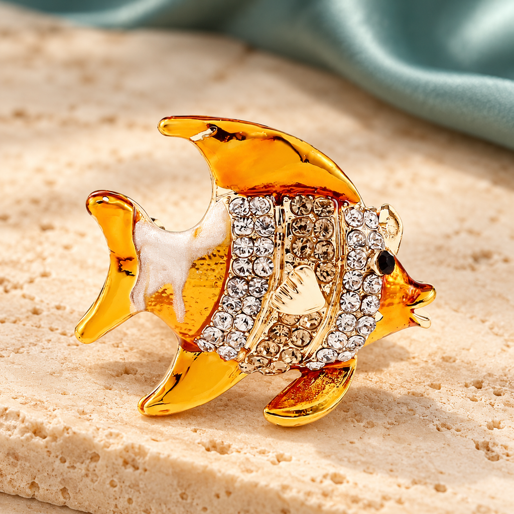 Golden Yellow Enamel Fish with Rhinestones Brooch — styled background