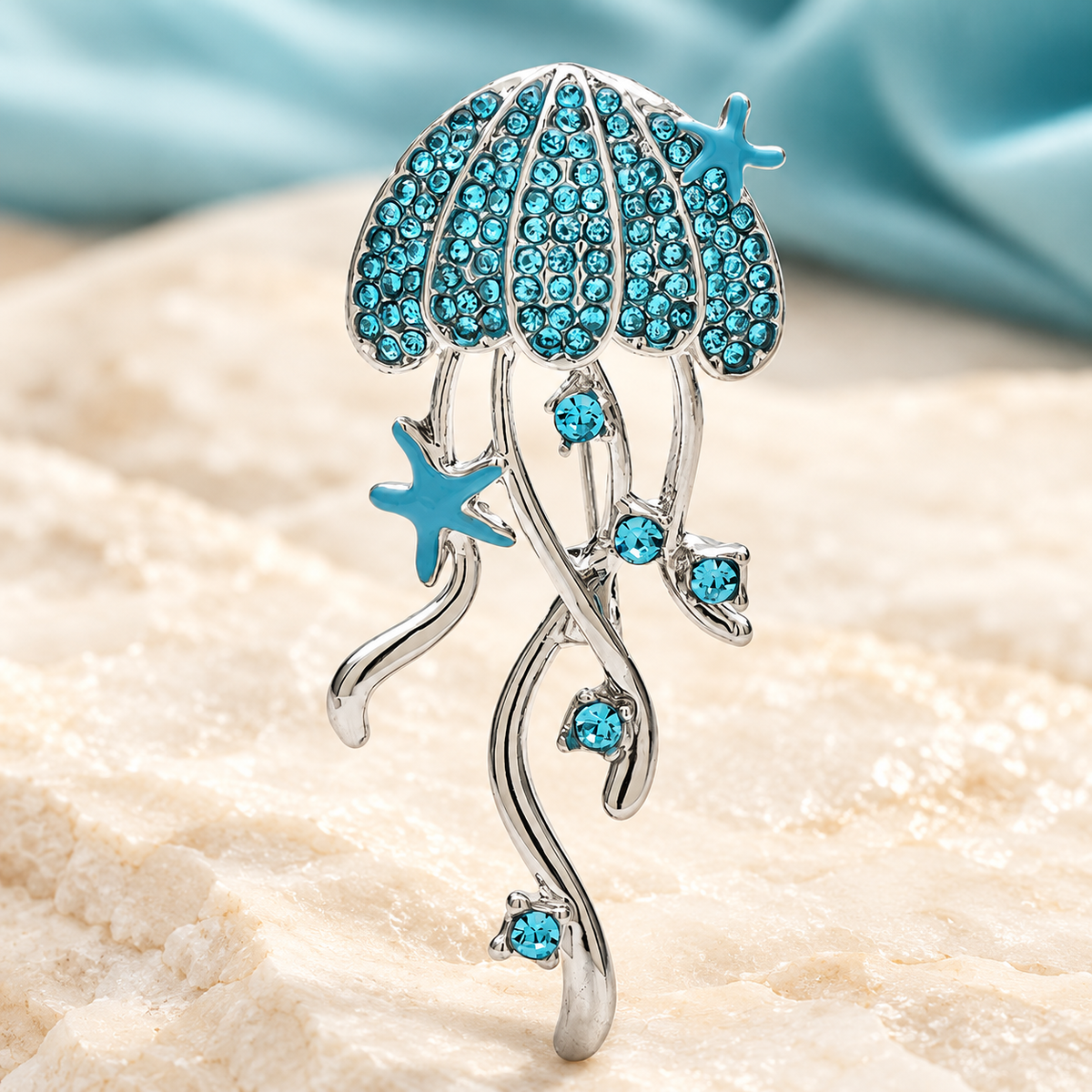 Rhinestone Jellyfish with Flowing Tentacles Brooch — styled background