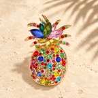 Multicolor Rhinestone Pineapple Brooch — styled background