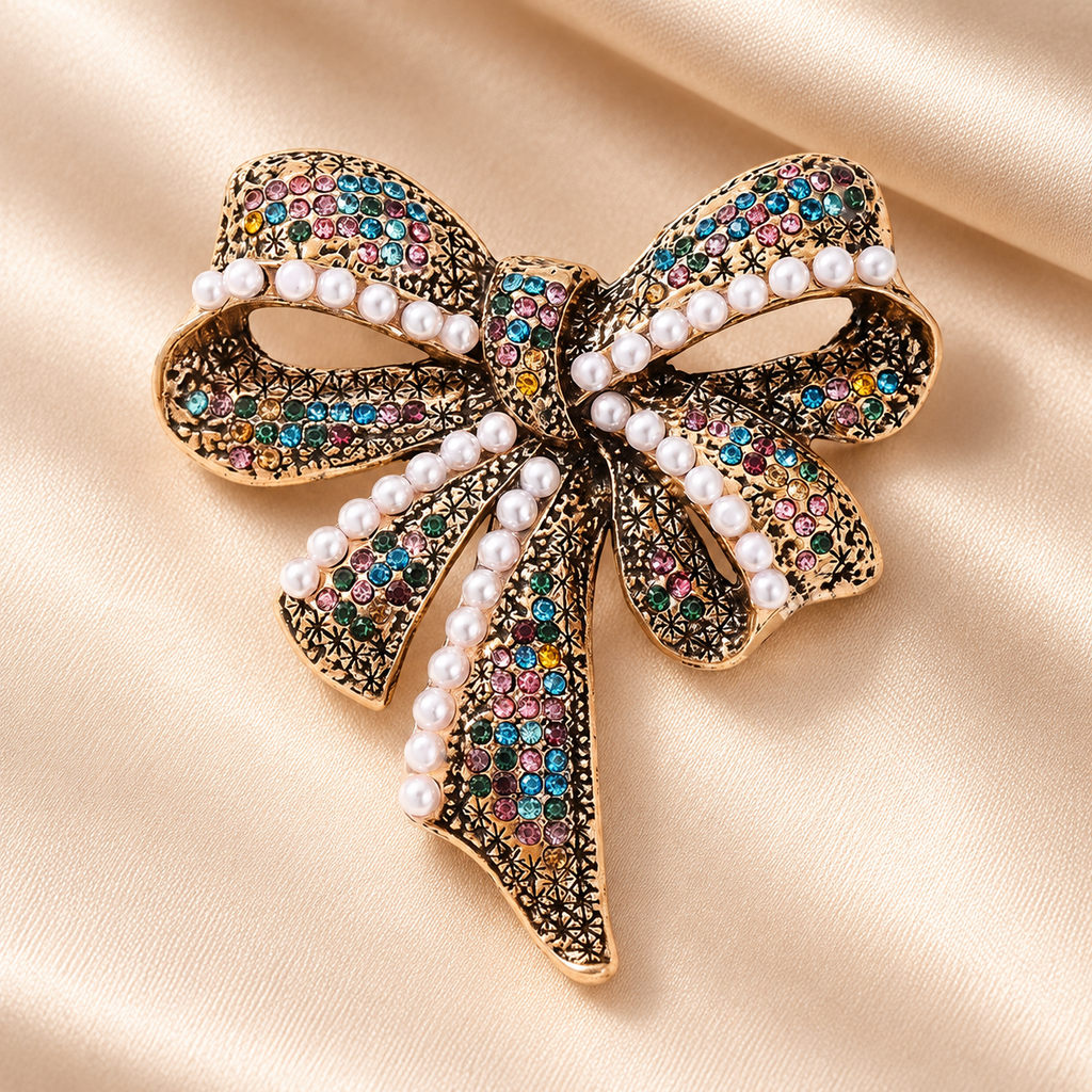 Vintage-Style Rhinestone Bow with Pearl-Look Beads Brooch — styled background