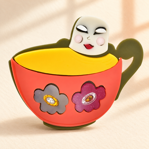 Acrylic Character in Floral Cup Brooch — styled background