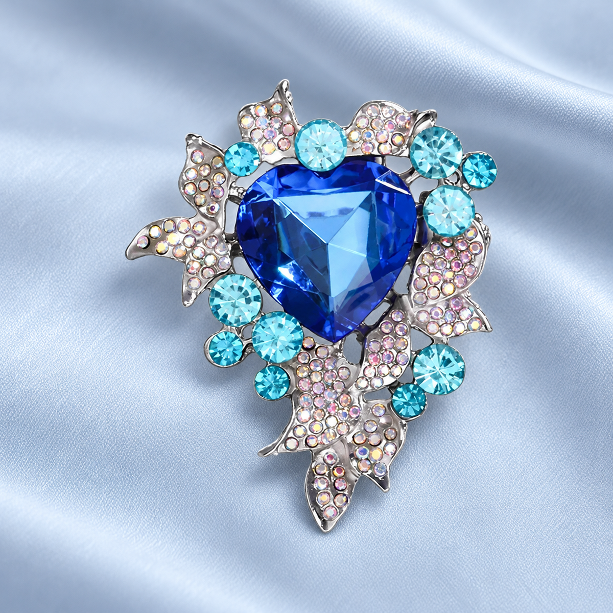 Faceted Heart with Floral Rhinestone Frame Brooch — styled background