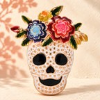 Floral Rhinestone Skull Brooch — styled background