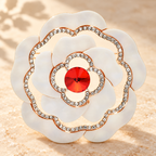 Layered White Flower with Faceted Center Brooch — styled background
