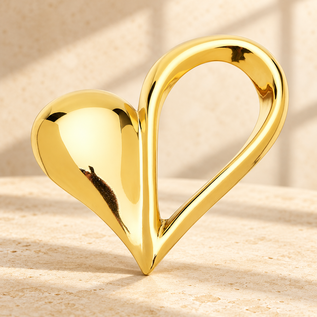Polished Asymmetric Open Heart Stainless Steel Brooch — styled background