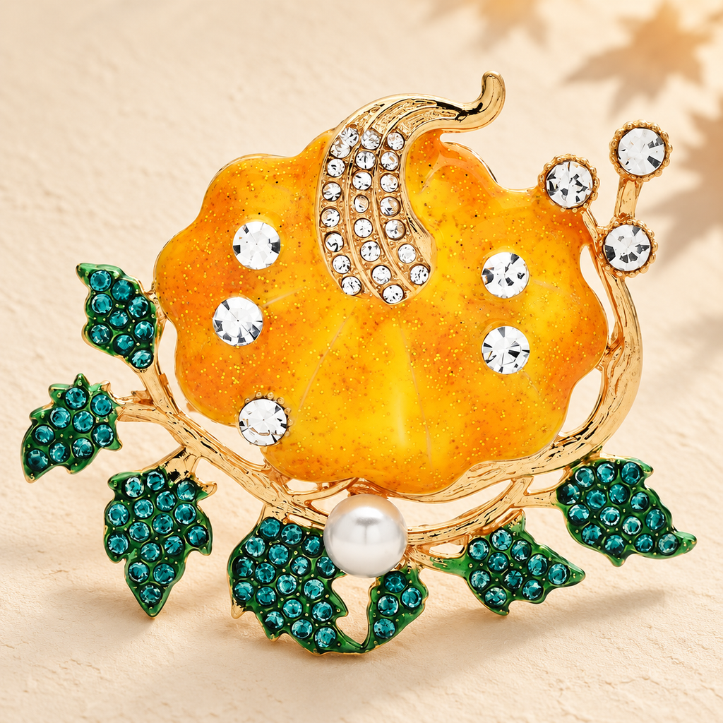 Enamel Pumpkin with Rhinestones and Leaves Brooch — styled background