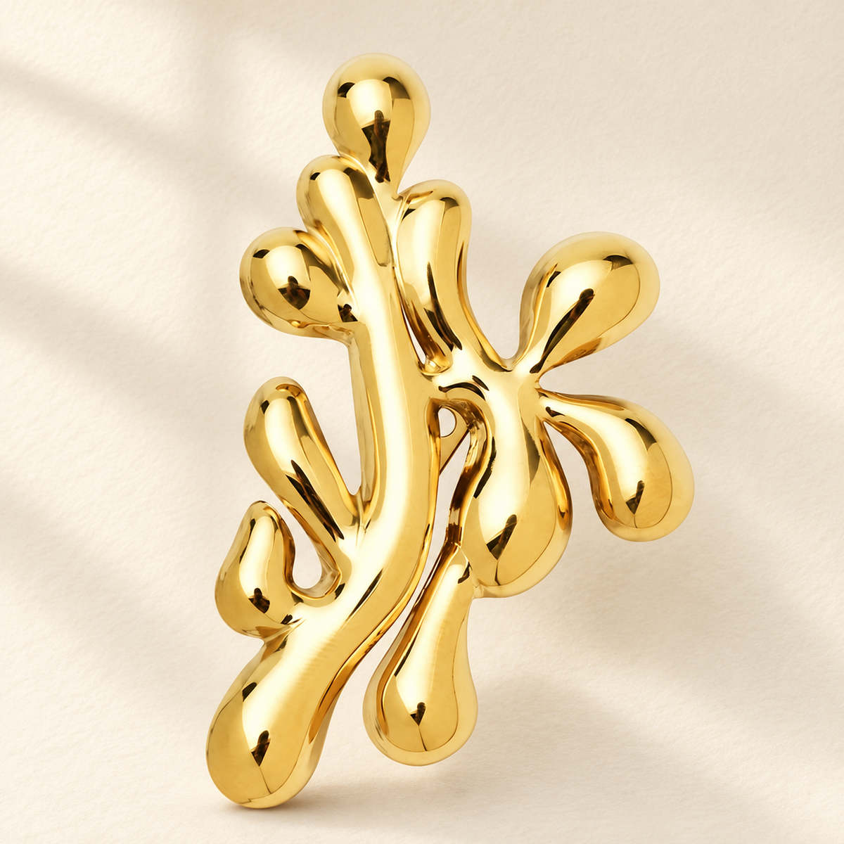 Polished Sperm Cell Cluster Brooch — styled background