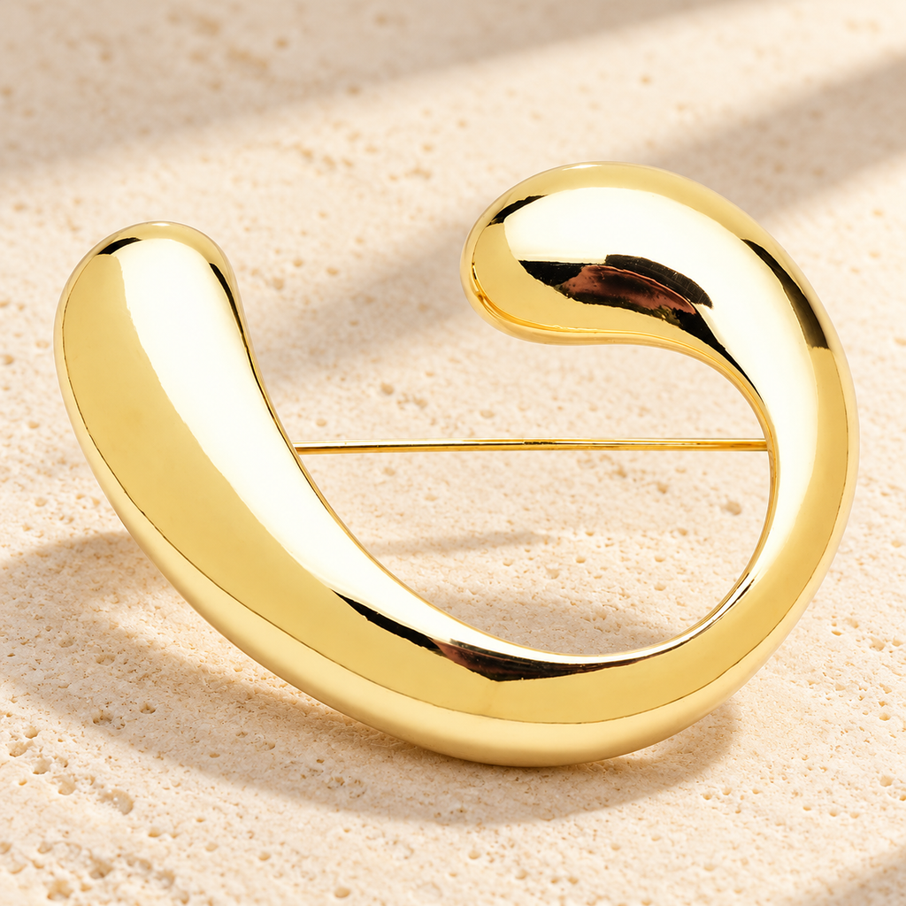 Polished Open Curve Brooch — styled background