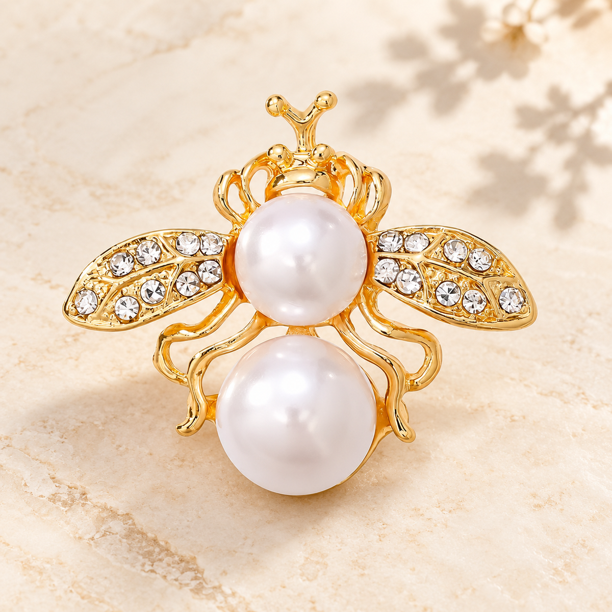 Pearl-Look Bee with Rhinestone Wings Brooch — styled background
